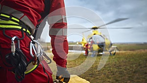 Safety harness of paramedic of emergency service in front of helicopter