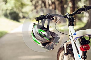 Safety helmet on the bicycle handlebar