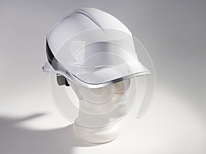 Safety helmet, white hard hat, mannequin head, health protection and safety precautions at work
