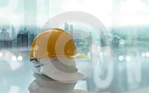 Safety helmets, Construction worker equipment on table in construction site and city background, Safety first