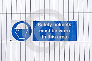 Safety helmets hard hats must be worn sign at construction site