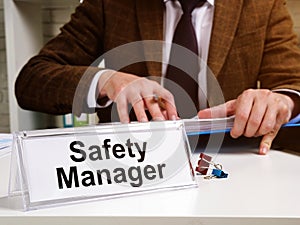 Safety manager works with instructions of OSHA Occupational Safety and Health Administration