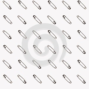 Safety pins on a white background