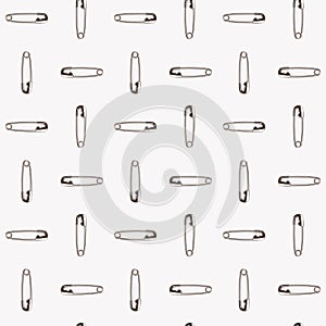 Safety pins on a white background