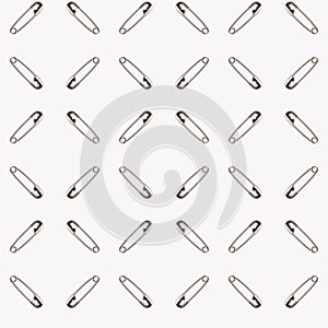 Safety pins on a white background