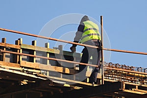 Safety risc worker without helmet at the construction site