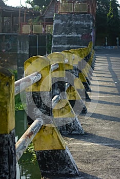 Safety road fence on the street paint in black and yellow