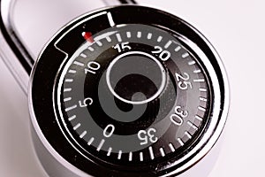 Safety or security concept, close up of code numbers on combination pad lock, locking device in which a sequence of symbols or nu