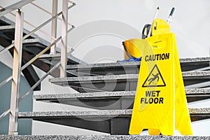 Safety sign with phrase Caution wet floor