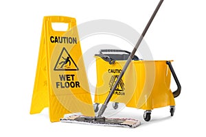 Safety sign with phrase Caution wet floor, mop and bucket on white background. Cleaning service