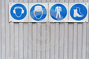 Safety signs and posters of personal protective equipment at work