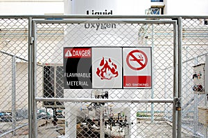 Safety signs warning DANGER-FLAMMABLE MATERIAL .