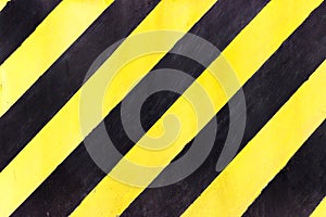 Safety stripes on construction site, Black and yellow Under construction sign over a grunge texture, top view