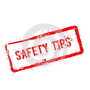 Safety tips red rubber stamp isolated on white.
