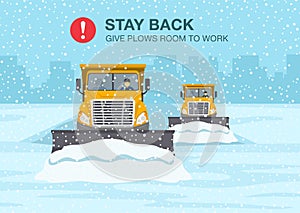 Safety winter driving rule. Snow plow truck is clearing snow away on winter highway.