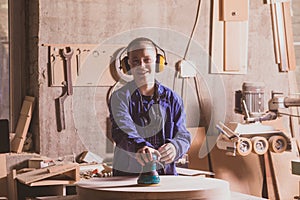 Safety in woodworking. Female carpenter in googles and dust mask