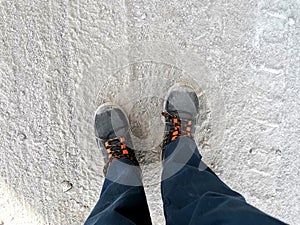 Safety work shoes, Personal Protective Equipment, top view of feet on gravel background. free copy space for your text.