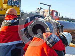 Safety at work. Welding and installation of the pipeline. Industrial weekdays welders and fitters