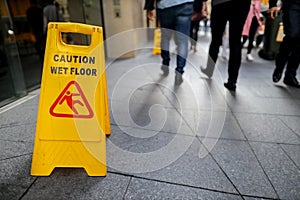 Safety workplace caution wet floor warning sign on the floor surfaces