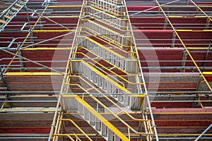 Safety in workplace. Renovation works. Scaffolding protects the workers from accidents
