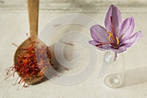 Saffron flower and spoon with saffron spice types