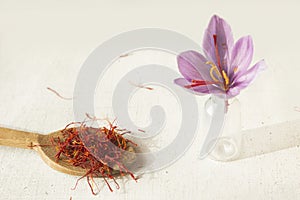Saffron flower and spoon with saffron types