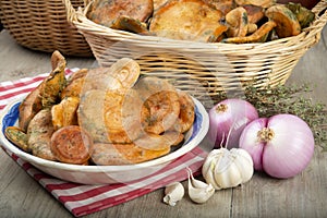 Saffron milk caps in baskets and bowls on the kitchen table