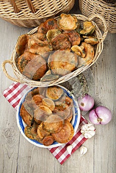 Saffron milk caps in baskets and bowls on the kitchen table