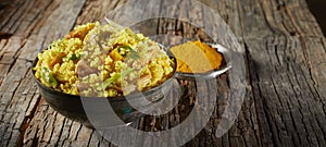 Safron or turmeric flavored bowl of couscous photo