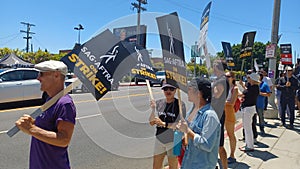 SAG AFTRA and WGA members picket Paramount Pictures