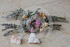 Sage & Lavender Smudge Sticks dried ready for burning having cleansing properties with pink and white quartz crystals photo