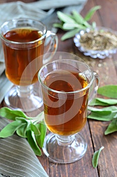 Sage tea on wooden background