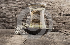 Sage tea on wooden table