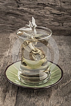 Sage tea on wooden table