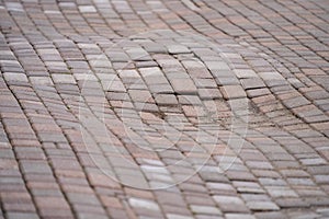 Sagging of paving slabs. Wavy surface of pavement. Copy space.