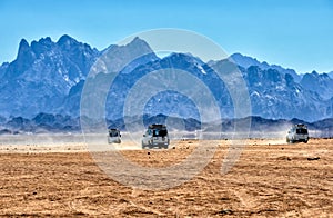 Sahara desert with jeeps for safari photo