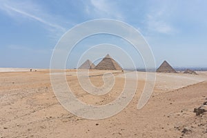 Sahara Desert with the Three pyramids of Giza