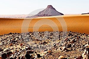 Everything flows. - Sahara landscape with Sand anf rocks formed by the wind