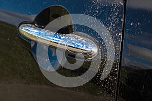 Saharan sand on car door handle