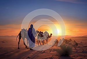 A saharian shepherd guides his herd in the desert