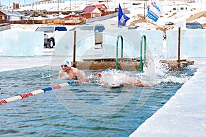 SAHYURTA ,IRKUTSK REGION, RUSSIA - March 11.2017: Cup of Baikal. Winter Swimming. Butterfly