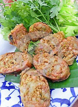 SAI AUA, Delicious tasty Golden NOTRHERN THAI SPICY SAUSAGE is a type of smoked roast with sticky rice.