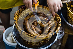 Sai Ua contains minced pork meat, herbs, spices, and Kaeng Khua red curry paste. photo