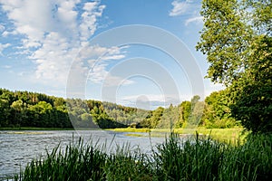 Saide stream falling into Neris river in Neris Regional Park near Vilnius, on sunny summer day