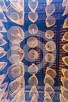 SAIGON, VIETNAM - FEB 13, 2018 - Spiral incense sticks hanging from the ceiling in Thien Hau Pagoda, dedicated to the Chinese sea