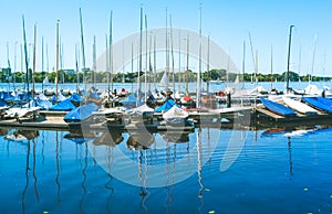 Sail boars for rent on the pier on Alster lake. Hamburg, Germany