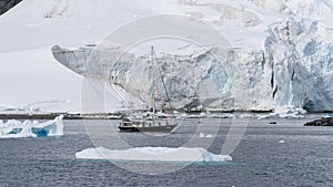 Sail boat in Antarctica waters. Antarctic Peninsula