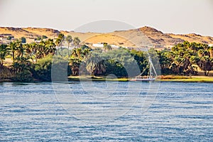 Sail boat by the bank of the Nile river