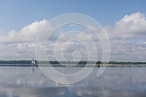 Sail boat on a calm lake