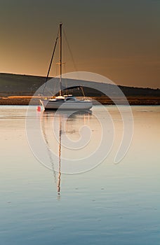 Sail boat in dawn light